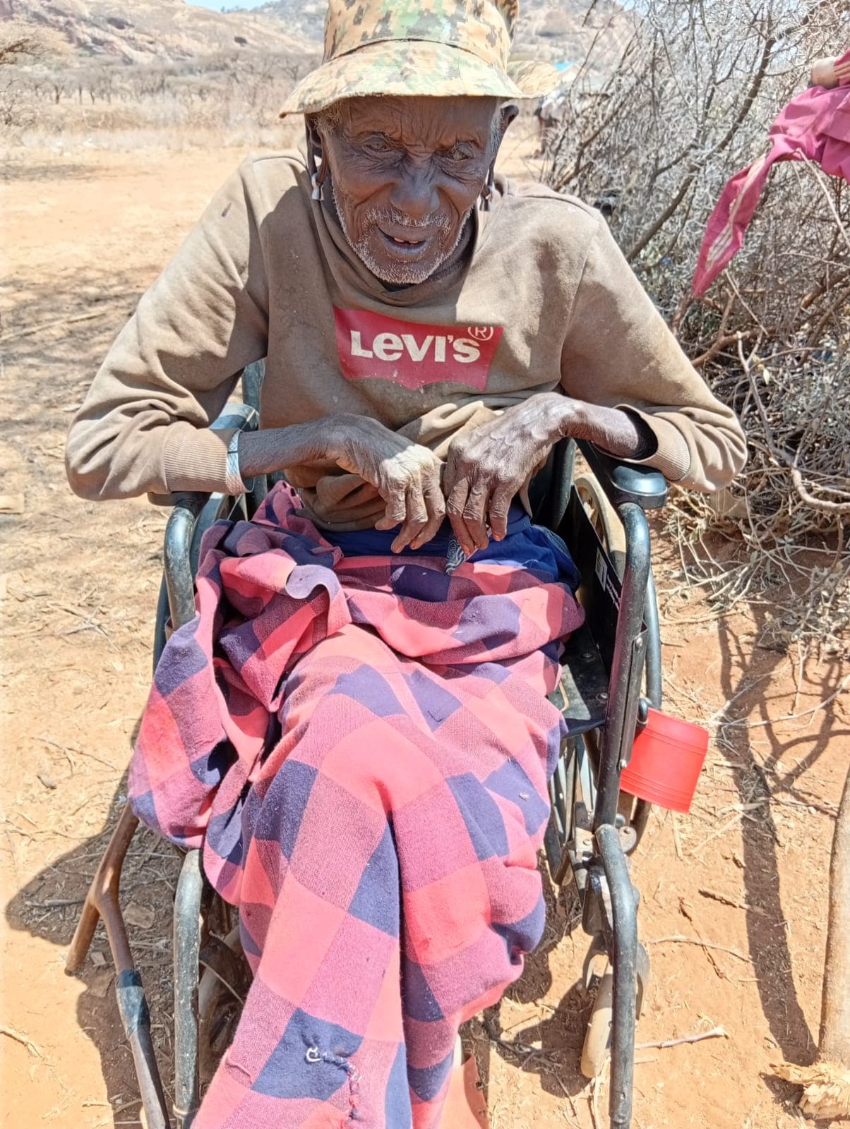 An elderly beneficiary receiving mobility support from NCOA
